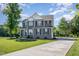 Traditional home exterior with gray siding, black shutters, and a well-maintained front lawn at 45 Leighann S Ct, Timberlake, NC 27583