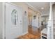 Bright foyer with hardwood floors, white trim, and a view into the living spaces at 45 Leighann S Ct, Timberlake, NC 27583