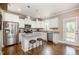 Modern kitchen with stainless steel appliances, granite countertops, and convenient island seating at 45 Leighann S Ct, Timberlake, NC 27583