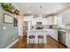 Bright and modern kitchen featuring stainless steel appliances, granite counters, and a center island at 45 Leighann S Ct, Timberlake, NC 27583