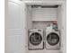 Convenient laundry room featuring modern washer and dryer with white cabinets at 45 Leighann S Ct, Timberlake, NC 27583