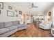 Bright open-concept living room with hardwood floors flowing into the adjacent dining and kitchen area at 45 Leighann S Ct, Timberlake, NC 27583