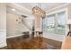Spacious living room showcasing hardwood floors, white trim, and a staircase to the upper level at 45 Leighann S Ct, Timberlake, NC 27583