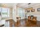 Open-concept living room with hardwood floors, natural light, and neutral decor at 45 Leighann S Ct, Timberlake, NC 27583