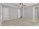 Bedroom featuring carpet, a ceiling fan with light, and a doorway at 4533 Whistling Way, Raleigh, NC 27616