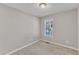 Neutral bedroom features a window, carpet flooring, and a ceiling light at 4533 Whistling Way, Raleigh, NC 27616