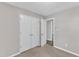 Bedroom featuring a closet, carpet flooring, and doorway to another room at 4533 Whistling Way, Raleigh, NC 27616