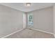 Bedroom featuring a window, carpet flooring, and a doorway at 4533 Whistling Way, Raleigh, NC 27616