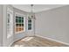 Bright dining area with large windows overlooking a wooden deck at 4533 Whistling Way, Raleigh, NC 27616
