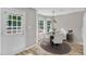 Cozy dining area with deck access, a modern chandelier and stylish decor at 4533 Whistling Way, Raleigh, NC 27616