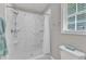 Walk-in shower with marble walls at 4533 Whistling Way, Raleigh, NC 27616
