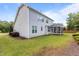 Expansive backyard featuring a screened-in porch and lush, green grass at 4562 Brighton Ridge Dr, Apex, NC 27539