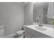 Bathroom with white vanity, faucet sink, tiled flooring and an elongated toilet at 4562 Brighton Ridge Dr, Apex, NC 27539