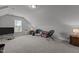 Spacious bedroom area featuring neutral colors, carpet flooring, and vaulted ceilings at 4562 Brighton Ridge Dr, Apex, NC 27539