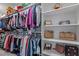 Walk-in closet featuring shelves and rods for organized storage at 4562 Brighton Ridge Dr, Apex, NC 27539