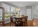 Sunlit dining area featuring a wood table, seating for four, and a large window view at 4562 Brighton Ridge Dr, Apex, NC 27539
