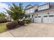 Lovely two-story home with a side entry garage and beautifully landscaped front yard and inviting entrance at 4562 Brighton Ridge Dr, Apex, NC 27539
