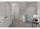 Hallway with carpeted floor, with multiple doors and staircase at 4562 Brighton Ridge Dr, Apex, NC 27539