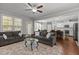 Open-concept living room offering views of the kitchen and dining area, and providing comfortable seating at 4562 Brighton Ridge Dr, Apex, NC 27539