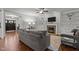 Inviting living room with fireplace, built-in cabinets, and two sofas arranged around a glass coffee table at 4562 Brighton Ridge Dr, Apex, NC 27539