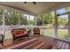 Relaxing screened porch furnished with wicker seating and views of the backyard at 4562 Brighton Ridge Dr, Apex, NC 27539