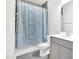 Bathroom featuring a shower with a blue and white curtain, a toilet, and a vanity at 4601 Okeechobee Ct, Fuquay Varina, NC 27526