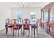 Dining room with hardwood floors, a decorative hutch, and large windows bringing in natural light at 4601 Okeechobee Ct, Fuquay Varina, NC 27526
