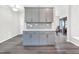 Bright kitchen features gray cabinetry, white countertops, and stylish gray and white tile backsplash at 4601 Okeechobee Ct, Fuquay Varina, NC 27526