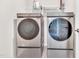 Modern laundry room featuring front load washer and dryer at 4601 Okeechobee Ct, Fuquay Varina, NC 27526