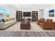 Bright living room with neutral colors, stylish furnishings, and large windows at 4601 Okeechobee Ct, Fuquay Varina, NC 27526