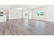 Open concept living room with lots of natural light and hard surface flooring at 4601 Okeechobee Ct, Fuquay Varina, NC 27526