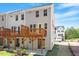The exterior of the townhouse showcases a wooden deck overlooking the backyard at 509 Sherron Rd # 11, Durham, NC 27703