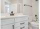 Bright bathroom features a double vanity and shower-tub combo with white finishes at 509 Sherron Rd # 11, Durham, NC 27703