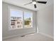 Bright bedroom with large windows offering a view of the neighborhood and surrounding trees at 509 Sherron Rd # 11, Durham, NC 27703