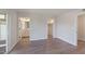 Bright bedroom boasts hardwood floors, ensuite bathroom, walk-in closet, and patio access at 509 Sherron Rd # 11, Durham, NC 27703