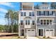 Stunning new townhome featuring stone accents, a balcony and a two-car garage at 509 Sherron Rd # 11, Durham, NC 27703