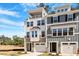 Beautiful townhomes with modern architectural details, front-entry garages, and inviting curb appeal at 509 Sherron Rd # 11, Durham, NC 27703