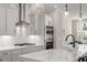 Modern kitchen features sleek white countertops, stainless steel appliances, and stylish backsplash at 509 Sherron Rd # 11, Durham, NC 27703