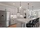 Contemporary kitchen with stainless appliances, white cabinets, an island, and pendant lighting at 509 Sherron Rd # 11, Durham, NC 27703