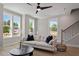 Inviting living room with hardwood floors, modern decor, and a staircase at 509 Sherron Rd # 11, Durham, NC 27703