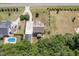 Sprawling property showcasing lush greenery, a private pool, and an extended driveway leading to the house at 5180 Old Powell Rd, Holly Springs, NC 27540