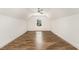 Bright bedroom with laminate floors and a ceiling fan at 5180 Old Powell Rd, Holly Springs, NC 27540