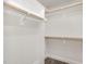 Spacious walk-in closet with built-in shelving and clothing rods at 5180 Old Powell Rd, Holly Springs, NC 27540