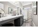 Stylish bathroom featuring a modern vanity with marble countertop and a shower-tub combo at 55 E American Marigold Dr # 36, Benson, NC 27504