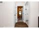 Hallway view to half bath featuring a pedestal sink and decorative mirror at 55 E American Marigold Dr # 36, Benson, NC 27504