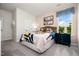Inviting bedroom with colorful patterned bedding, stylish window treatments, and a bedside table at 55 E American Marigold Dr # 36, Benson, NC 27504