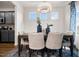This dining room, with a view of the kitchen, features modern lighting, four windows, and an area rug at 55 E American Marigold Dr # 36, Benson, NC 27504