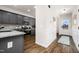 Welcoming view of the home's entryway, with sightline to the kitchen, featuring wood-look flooring and wainscoting at 55 E American Marigold Dr # 36, Benson, NC 27504