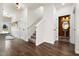 Bright hallway with vinyl flooring, stairwell and a powder room with decorative wainscoting at 55 E American Marigold Dr # 36, Benson, NC 27504