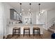 A modern kitchen with granite countertops, bar seating and pendant lighting at 55 E American Marigold Dr # 36, Benson, NC 27504